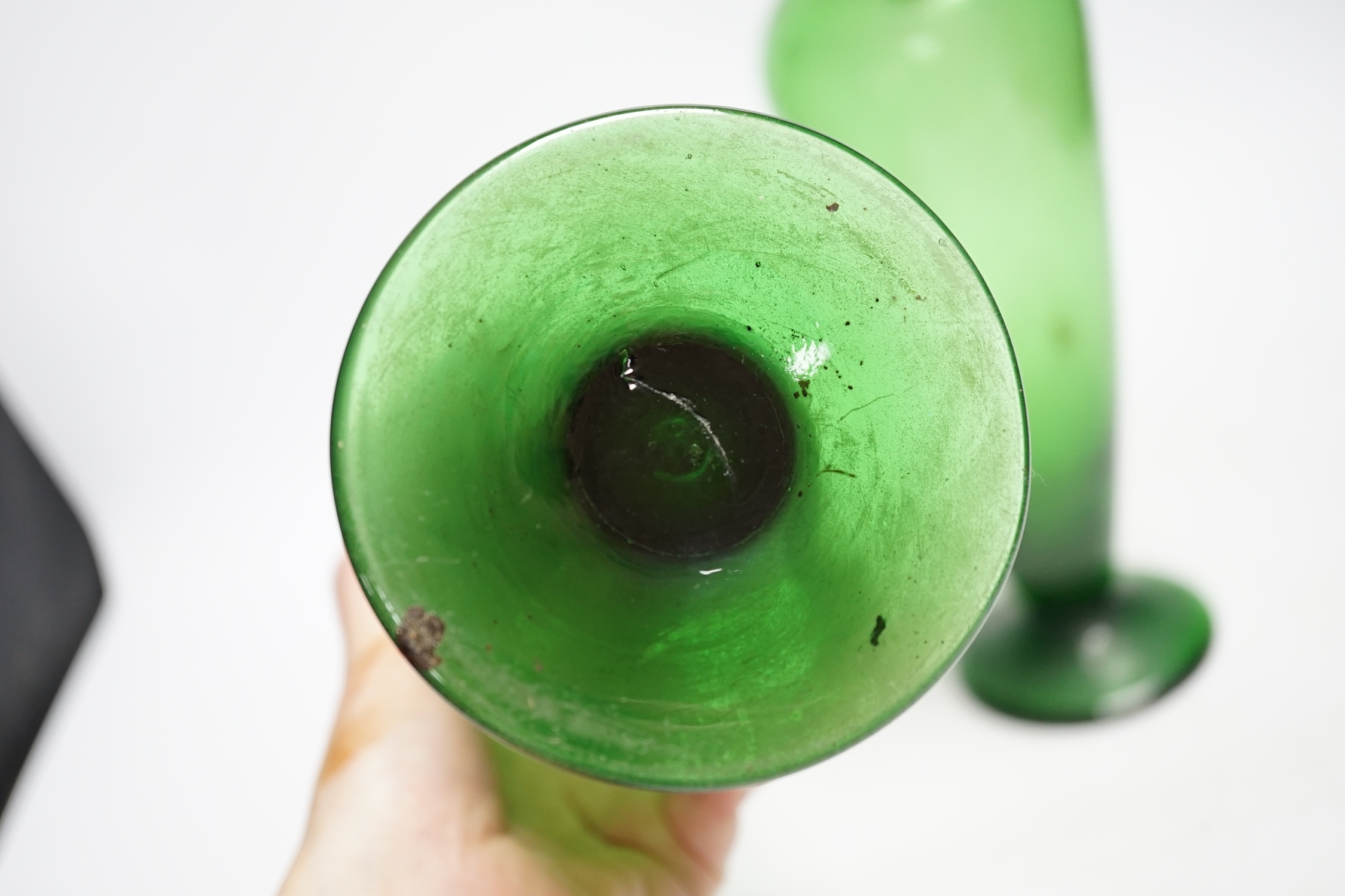 A pair of double handle green glass vases, 33cm
